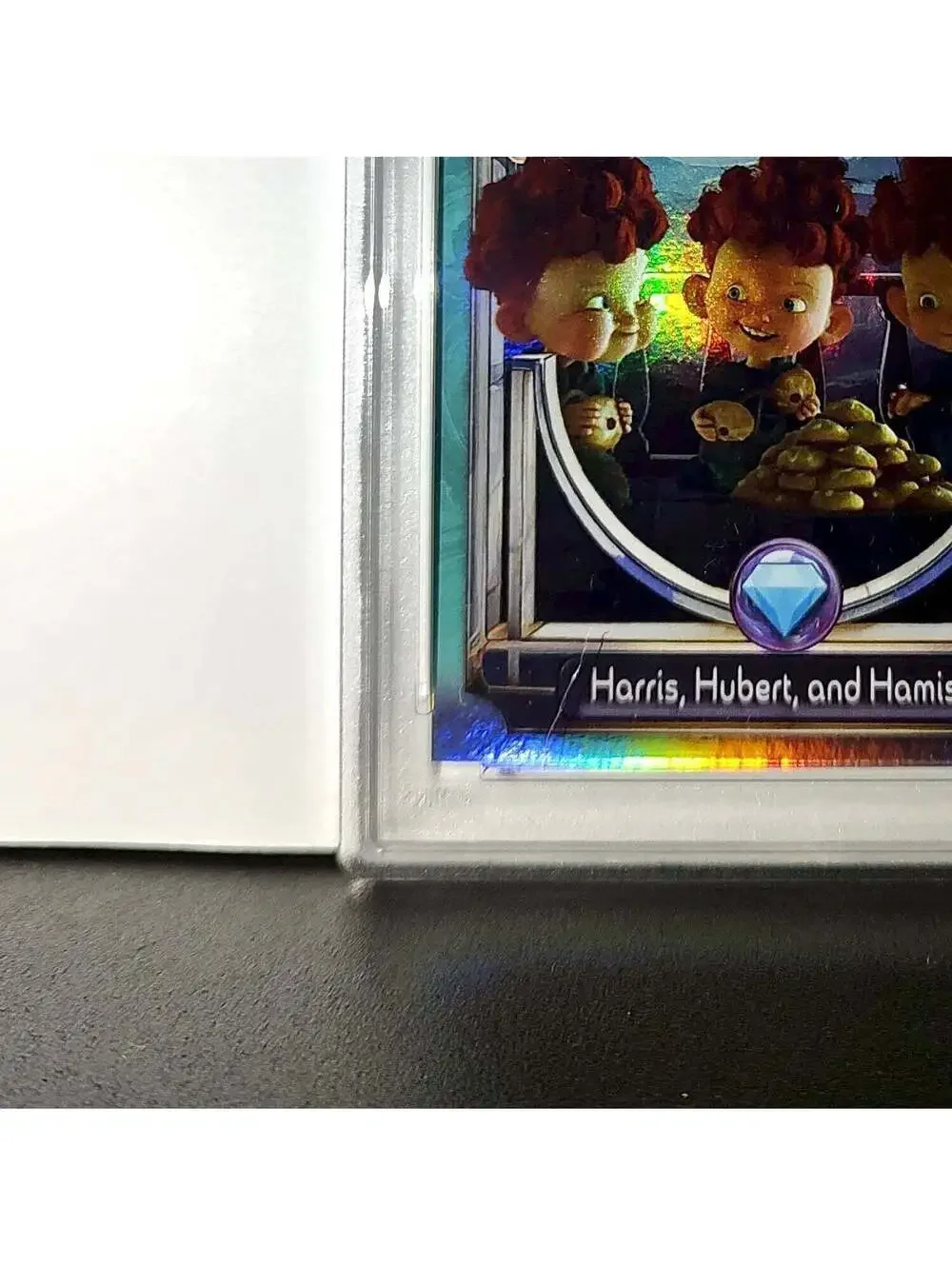 Harris, Hubert, and Hamish 2025 Topps Disney #147 Diamond Card Brave PSA 8